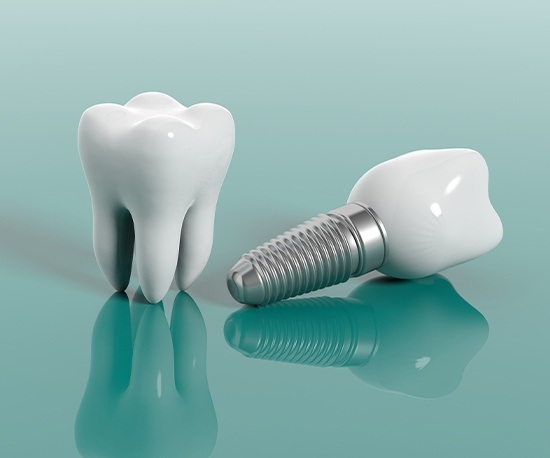 fake tooth next to a dental implant in Murphy