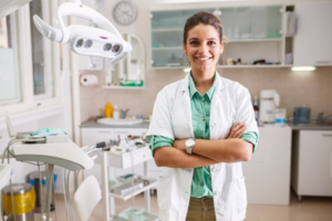 Dentist smiling in their treatment room